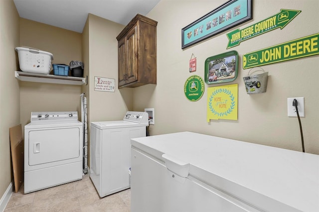 laundry area featuring cabinet space and independent washer and dryer