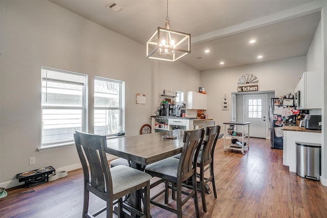 dining area featuring a notable chandelier, recessed lighting, visible vents, baseboards, and hardwood / wood-style floors