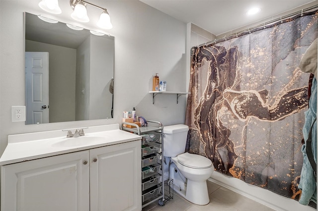 bathroom featuring a shower with shower curtain, vanity, toilet, and tile patterned floors