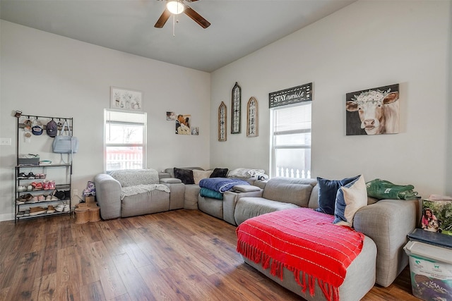 living area with a ceiling fan, hardwood / wood-style flooring, and a healthy amount of sunlight