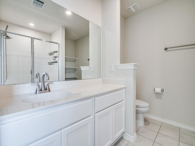 full bath featuring a stall shower, visible vents, toilet, tile patterned flooring, and vanity