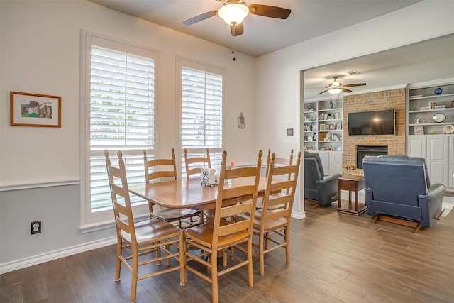 dining space featuring ceiling fan, baseboards, and wood finished floors