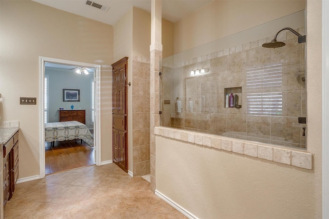 bathroom with visible vents, a walk in shower, and tile patterned floors