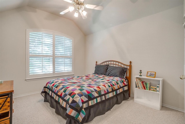 carpeted bedroom featuring lofted ceiling, ceiling fan, and baseboards