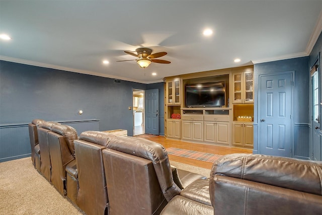 living room featuring ceiling fan, a wainscoted wall, recessed lighting, and crown molding