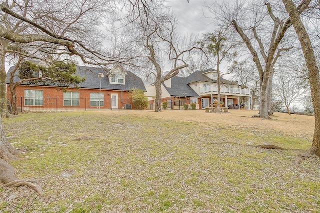 view of yard featuring fence and a deck