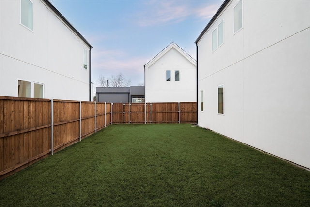 view of yard with a fenced backyard