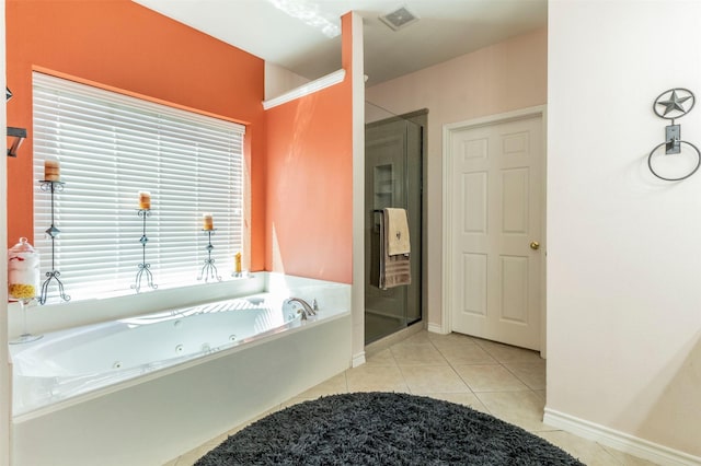 full bathroom with tile patterned flooring, visible vents, baseboards, a jetted tub, and a stall shower