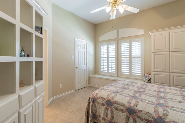 bedroom with baseboards, a ceiling fan, and light colored carpet