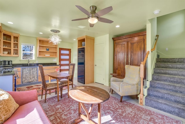 interior space with stairs, recessed lighting, and a ceiling fan