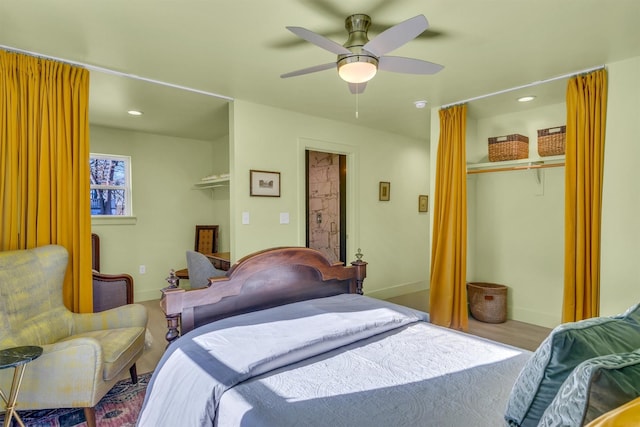 bedroom featuring a closet, baseboards, and a ceiling fan