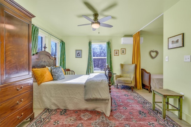 bedroom featuring multiple windows, a wall mounted AC, and a ceiling fan