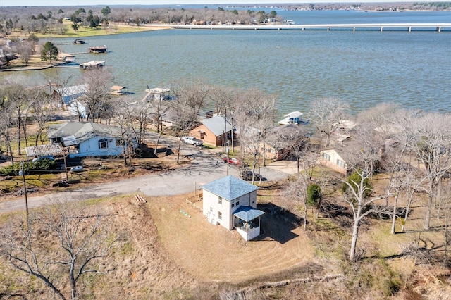 birds eye view of property featuring a water view