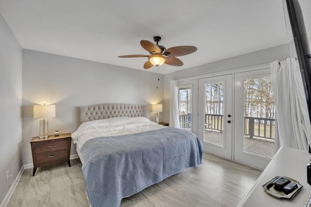 bedroom featuring access to exterior, french doors, ceiling fan, and baseboards