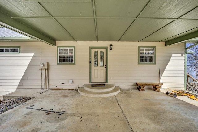 entrance to property featuring a patio