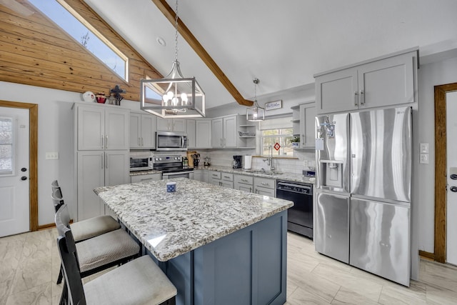 kitchen with tasteful backsplash, appliances with stainless steel finishes, vaulted ceiling with beams, light stone countertops, and open shelves