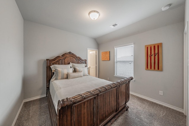 bedroom featuring dark colored carpet, visible vents, and baseboards