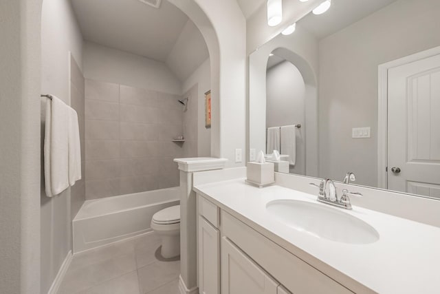 bathroom featuring toilet, shower / bathtub combination, vanity, and tile patterned floors