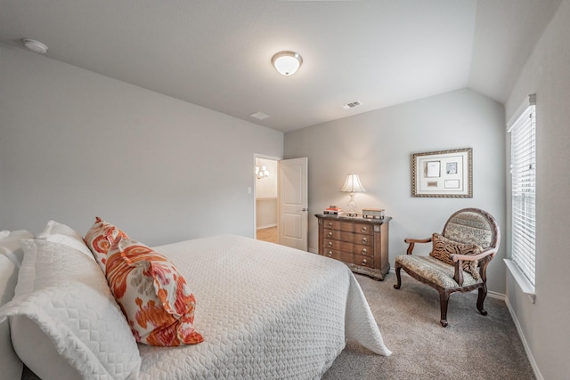 bedroom with lofted ceiling, baseboards, visible vents, and carpet flooring