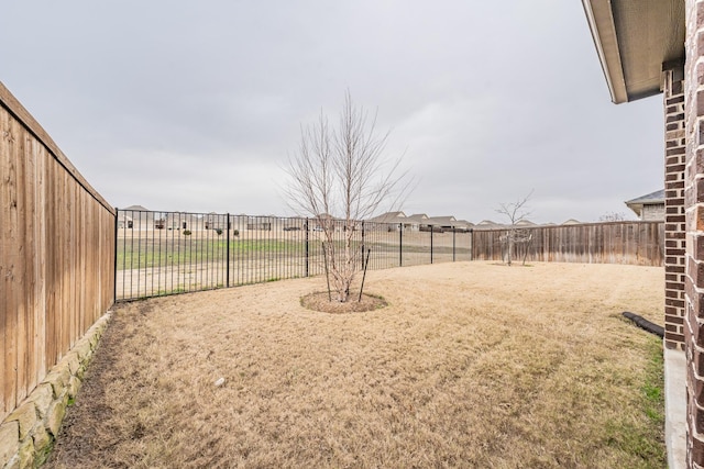 view of yard featuring a fenced backyard