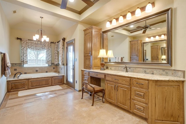 full bath with a tray ceiling, a garden tub, crown molding, and ceiling fan with notable chandelier