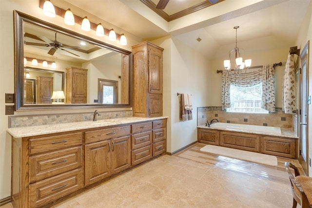 bathroom with tasteful backsplash, a raised ceiling, crown molding, and ceiling fan with notable chandelier