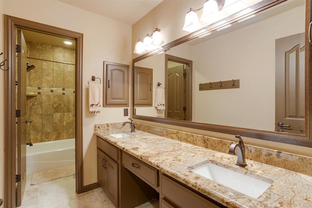 full bathroom with double vanity, bathtub / shower combination, and a sink