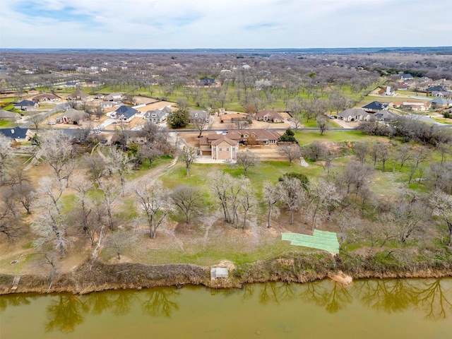 drone / aerial view featuring a water view and a residential view