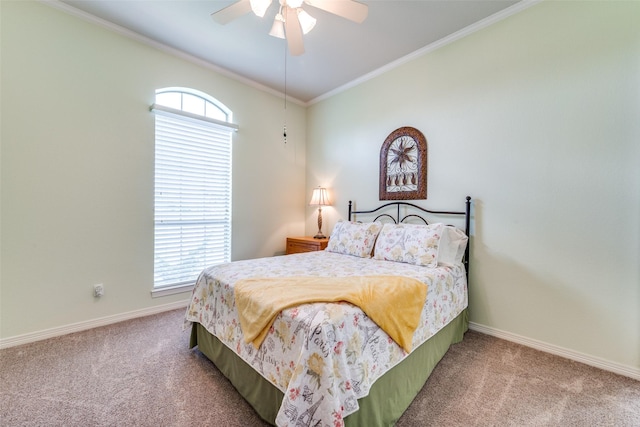 carpeted bedroom featuring crown molding, a ceiling fan, and baseboards