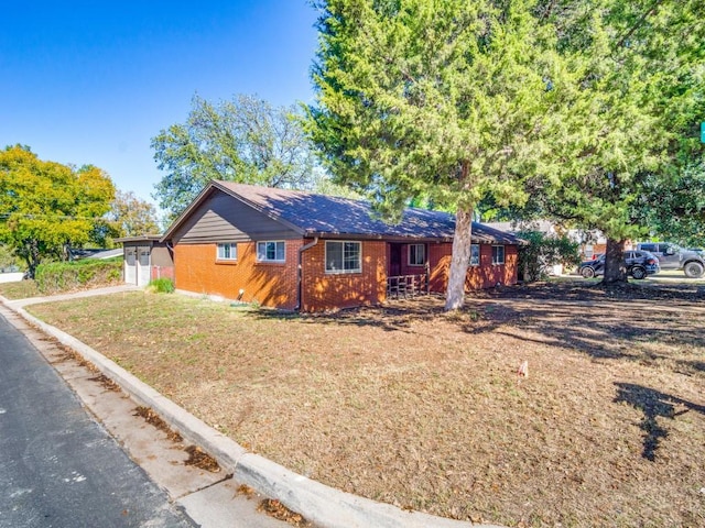 single story home with brick siding