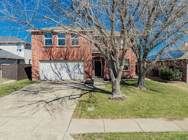 view of front facade with driveway, a garage, brick siding, fence, and a front yard