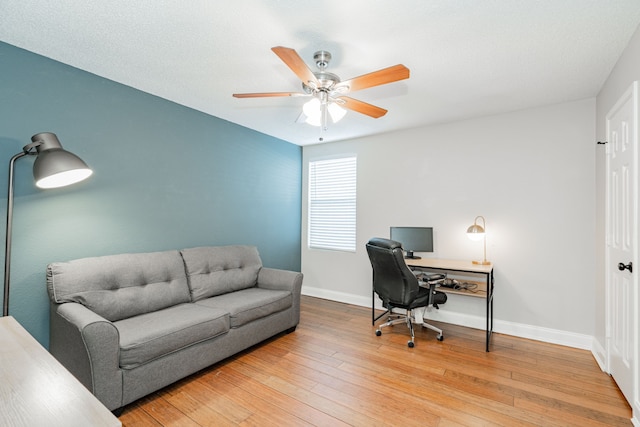 home office with wood-type flooring, baseboards, and a ceiling fan