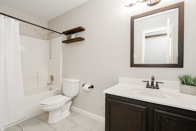 bathroom with a textured ceiling, tile patterned flooring, toilet, vanity, and baseboards