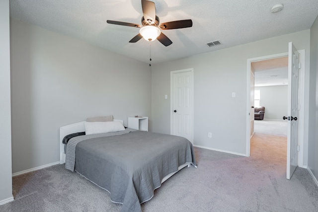 bedroom with carpet flooring, visible vents, and baseboards