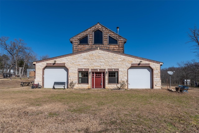 view of front facade with a garage and a front yard