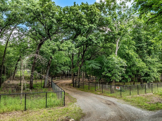 263 Esquire Dr, Denison, TX 75021 - view of side of property with a garage and stone siding