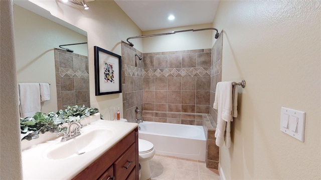 bathroom featuring shower / washtub combination, tile patterned flooring, vanity, and toilet