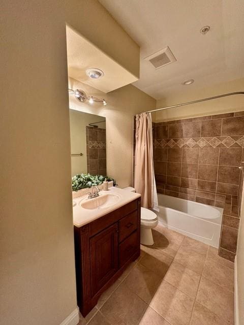 full bathroom with shower / tub combo, visible vents, toilet, tile patterned floors, and vanity