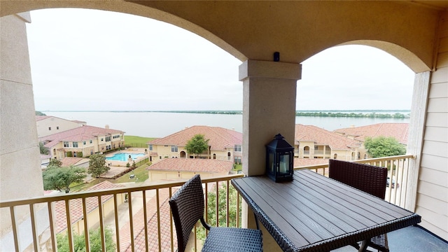 balcony featuring a water view