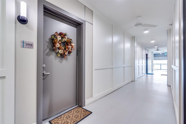 view of exterior entry featuring ceiling fan