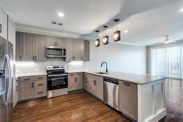 kitchen featuring stainless steel appliances, gray cabinets, a sink, and visible vents