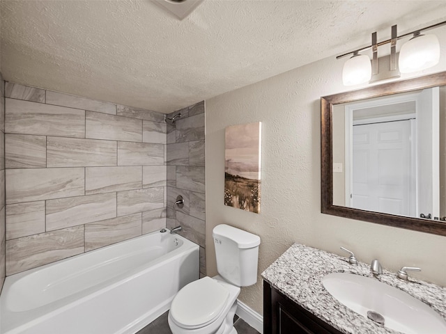 bathroom with toilet, a textured wall, a textured ceiling, and vanity