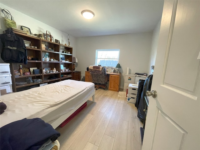 bedroom with light wood-type flooring