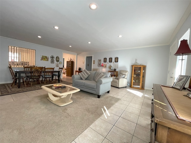 living area featuring light tile patterned floors, baseboards, ornamental molding, and recessed lighting