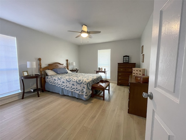 bedroom featuring a ceiling fan and light wood finished floors