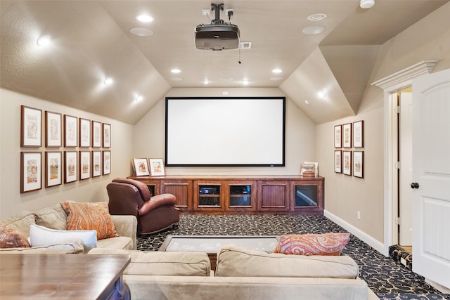 home theater room with lofted ceiling, recessed lighting, visible vents, and baseboards