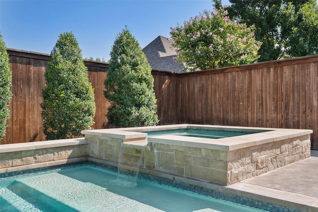 view of pool featuring a fenced backyard, a fenced in pool, and an in ground hot tub