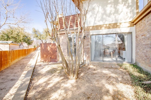 view of patio featuring fence