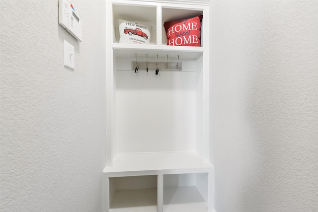 mudroom with a textured wall