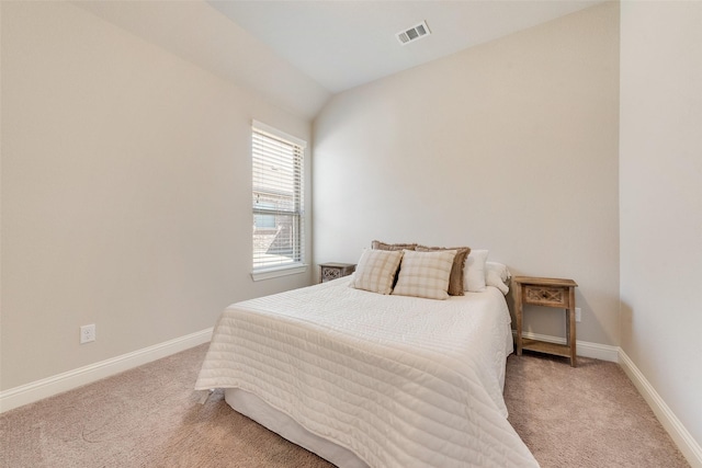 bedroom with carpet floors, baseboards, and visible vents